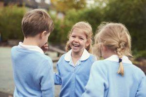 children laughing in the playground